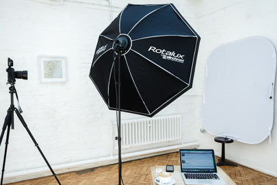Heashot photographer London studio setup in client office with portable backdrop and lighting