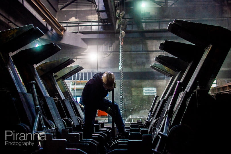 Factory worker photographed in Germany for private equity client.