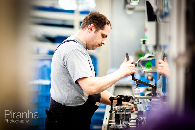 Factory worker photographed in Germany for private equity client.