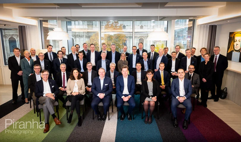 Corporate Photographer Discusses How to Best Organise and Take Group Photographs 6 Larger group photograph - organised so that everyone will be visible in large London office space