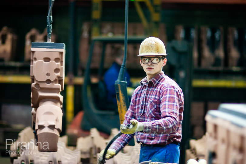 Factory worker photographed in Germany for private equity client.