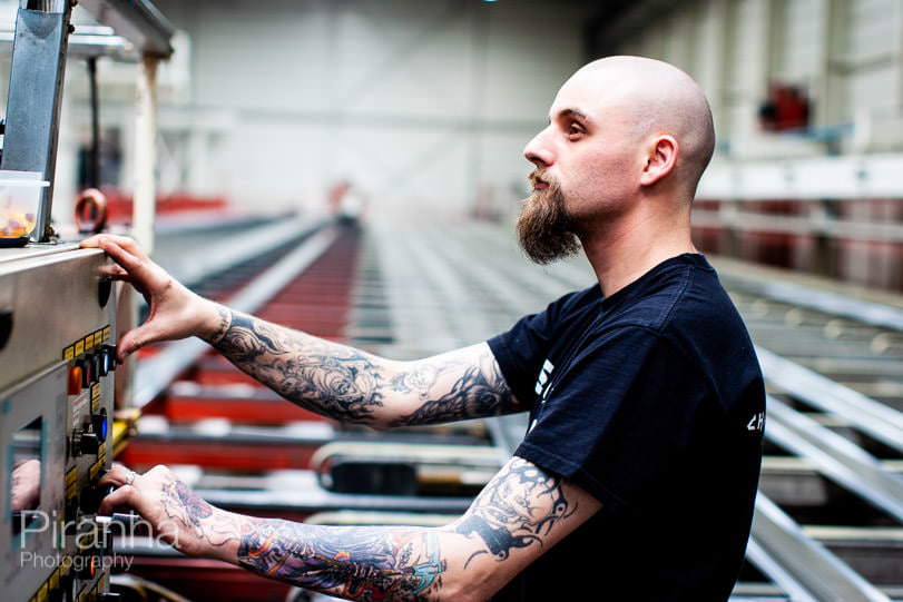 Factory worker photographed in Germany for private equity client.