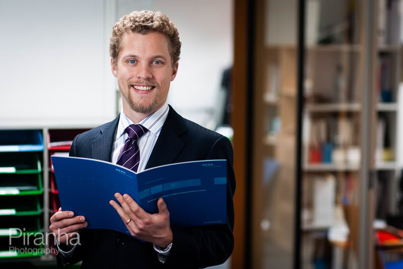 Consultant photographed in London office library