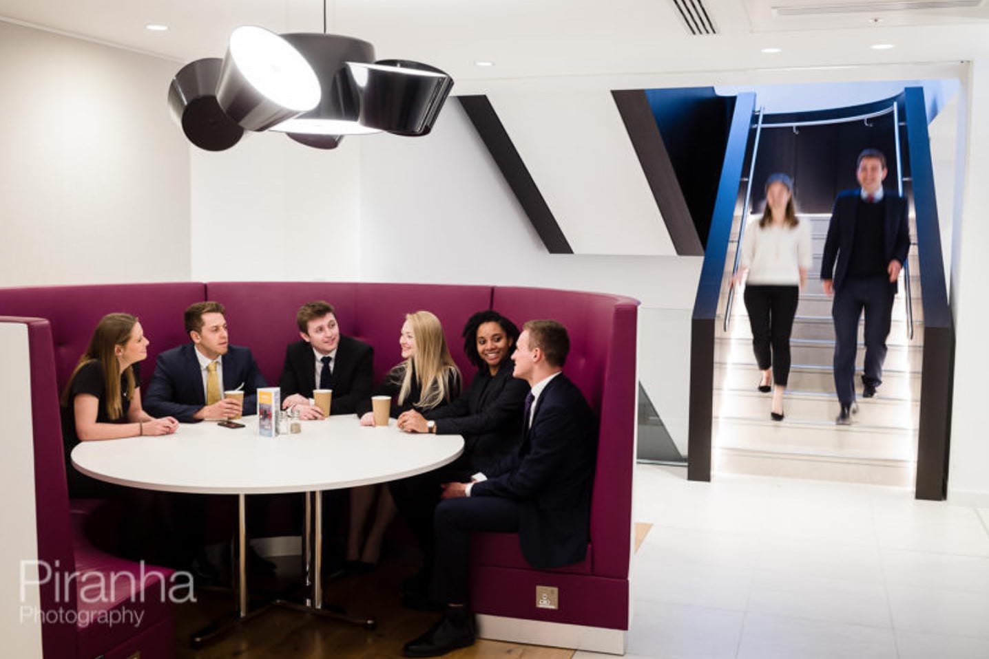 Graduates photographed at solicitors offices for brochure