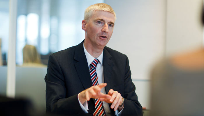 Photograph of Staff Member in Meeting for Company Report