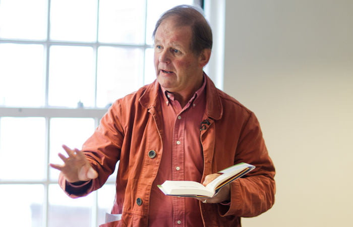 Photograph of Michael Morpurgo reading from his book 'I believe in Unicorns'