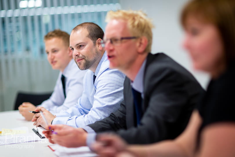 Management photography in working meeting for FTSE100 company