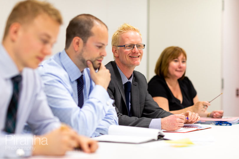 Management photography in working meeting for FTSE100 company