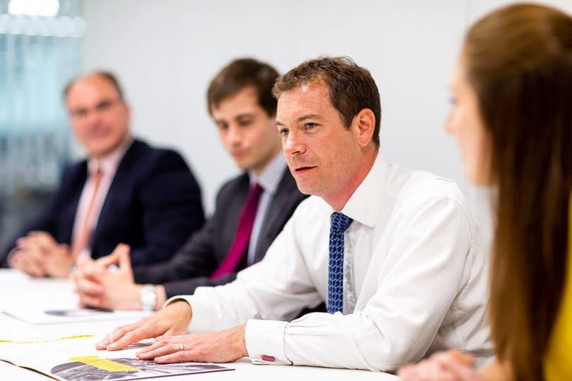 Management photography in working meeting for FTSE100 company