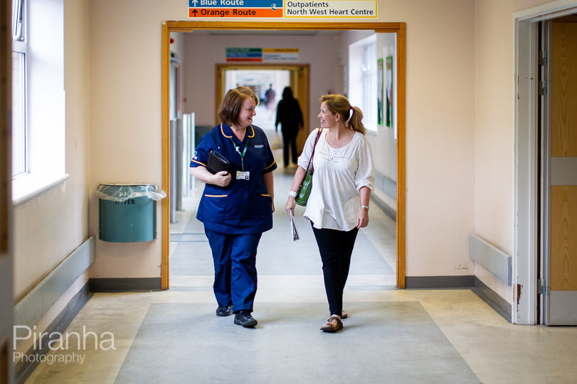 Professional photograph of nurse with patient in Manchester hospital