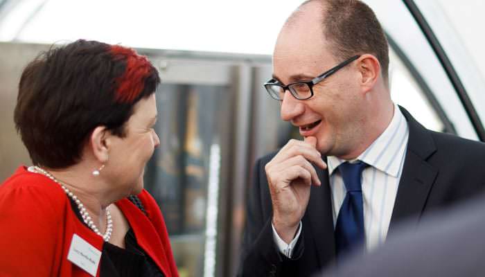 Drinks Party Photographer - Guests Talking at Trafalgar Hotel, London