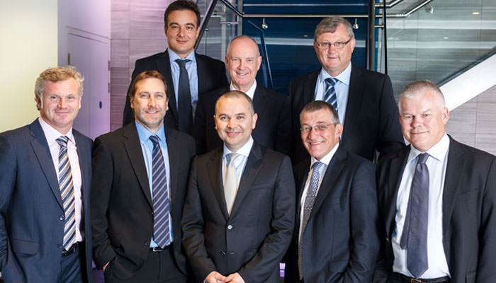 management-group-photo Management Photograph as Group in London Offices - team shot