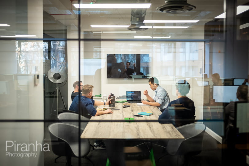 AI company photography of business meeting in London offices