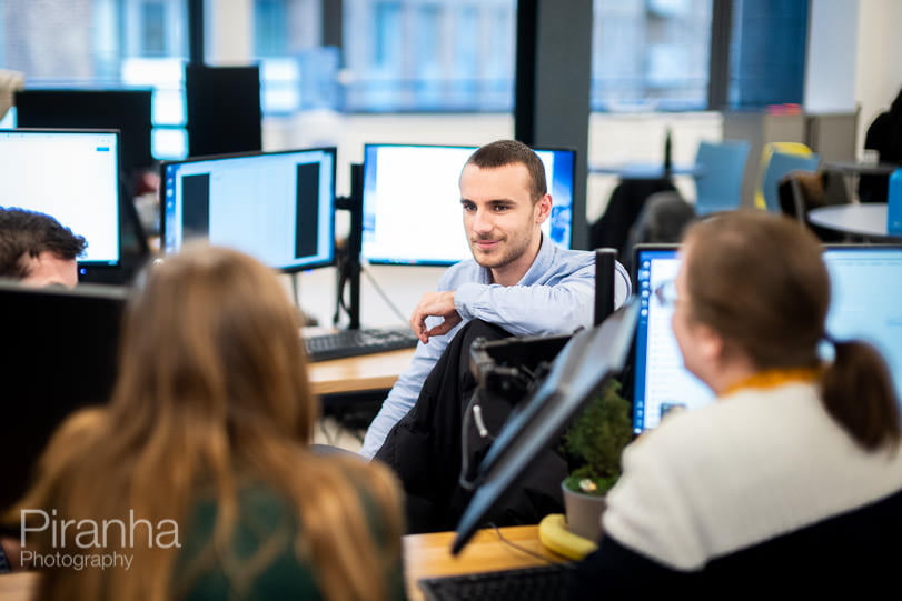 AI company staff photography of business meeting in London offices