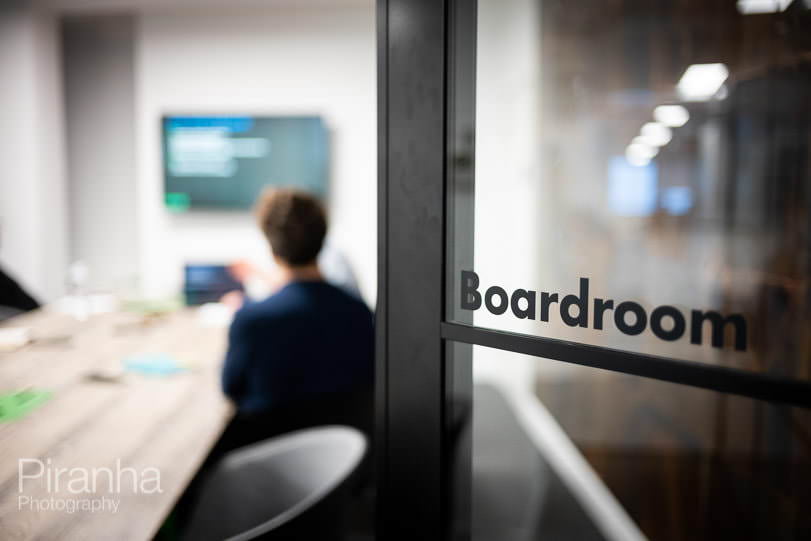 Website home page photograph of board room.