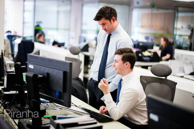 Staff discussing in London office