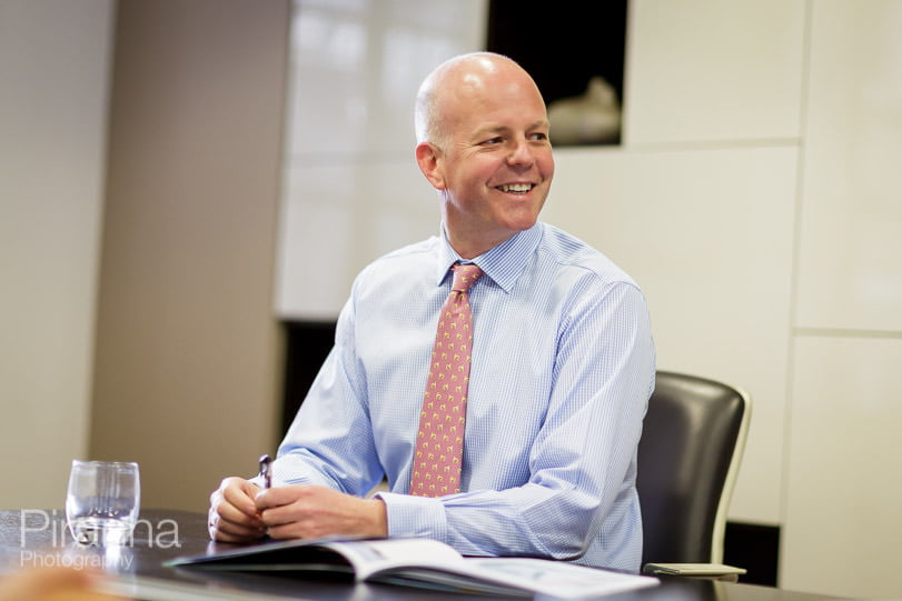 Director of London bank photographed in meeting