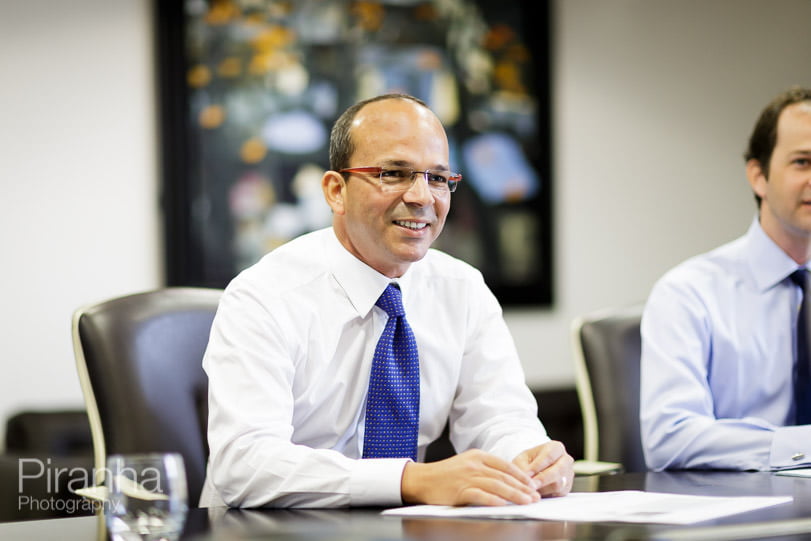 Director of London bank photographed in meeting