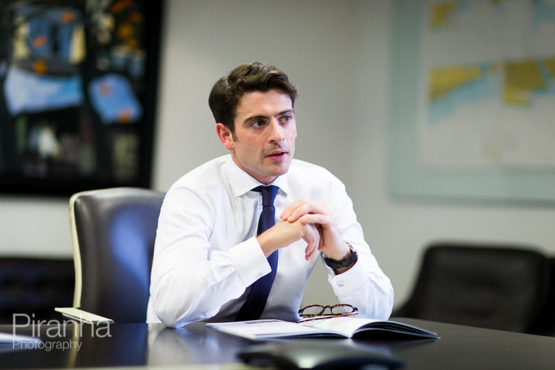 Employee of London bank photographed in meeting