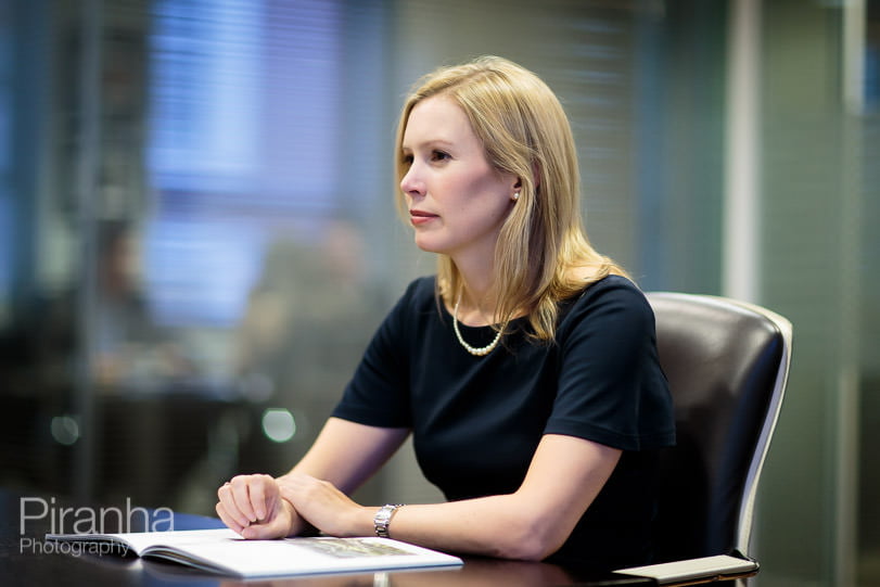 Member of staff of London bank photographed in meeting