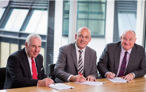 Photograph of deal signing in London