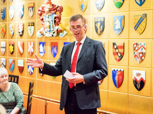 Speeker presenting long service awards at Founders' Hall in London during evening reception