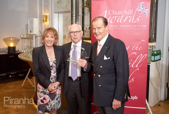 Esther Rantzen and Sir Roger Moore presenting awards