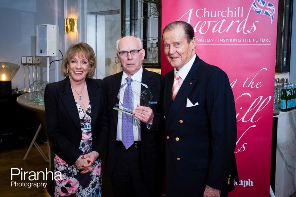 Esther Rantzen and Sir Roger Moore presenting awards