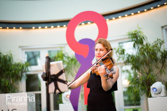 Charity Event at Hurlingham Club in Fulham with HRH Princess Anne 5 Violin player at Corporat Party Photographed in London