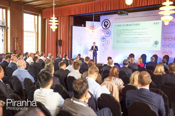 Speaker on stage at conference