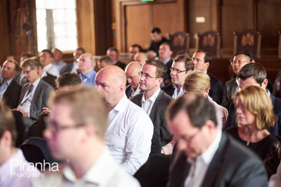 Audience listening to speakers at conference