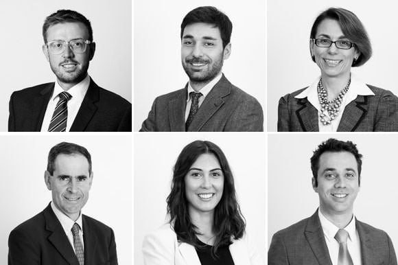 Business Portraits for Website Appearing in Black and White 2 Headshots of employees against white background