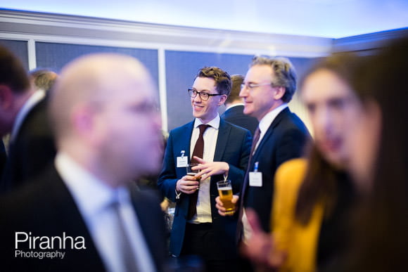 Corporate Event Photographed at Glazier's Hall in London 6 Individuals chatting at drinks reception in London