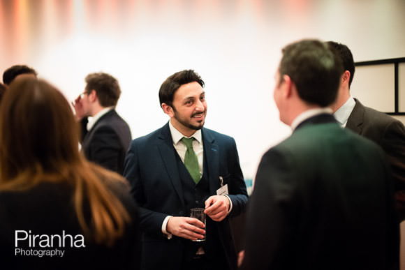 Guests mingling at drinks reception of corporate event in London