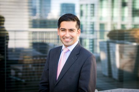 Business Portrait of Employee with Window behind and outside scene