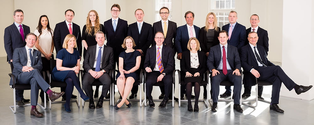 Shot of chartered surveyors team all together in London offices