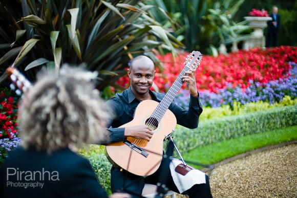 Band member playing guitar at Waddeson Manor - Company Summer Party