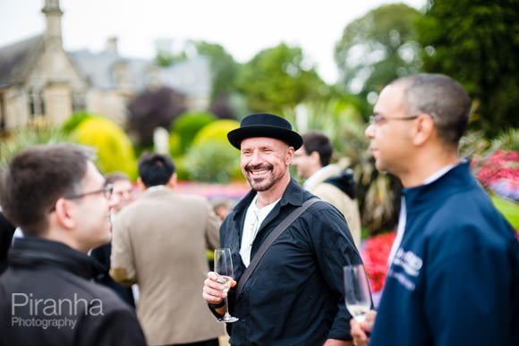 Guests having drinks at summer party outside