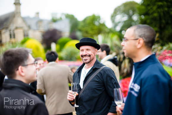 Guests having drinks at summer party outside