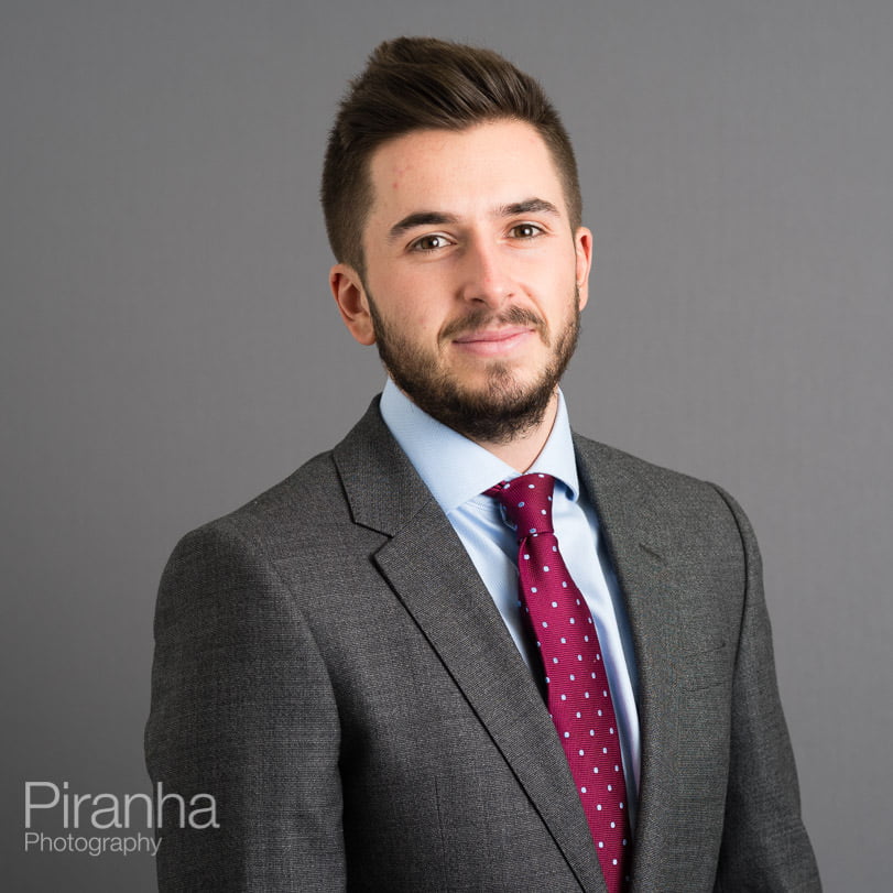 Headshot for law firm with grey background