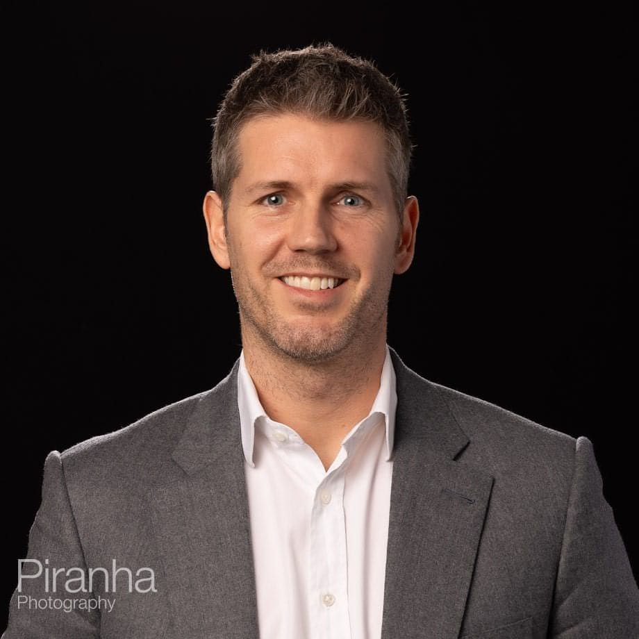 Headshots taken against a black background back drop.