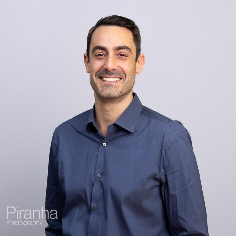 Headshots against white backdrop.