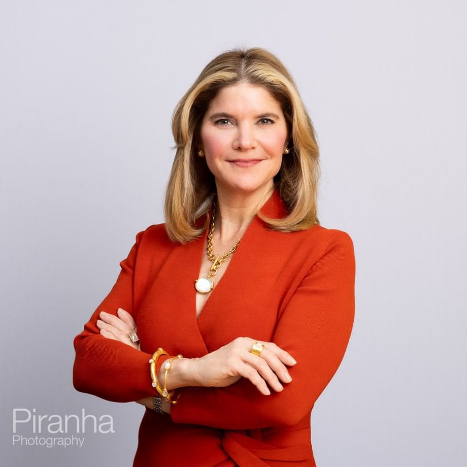 Headshots against white backdrop.