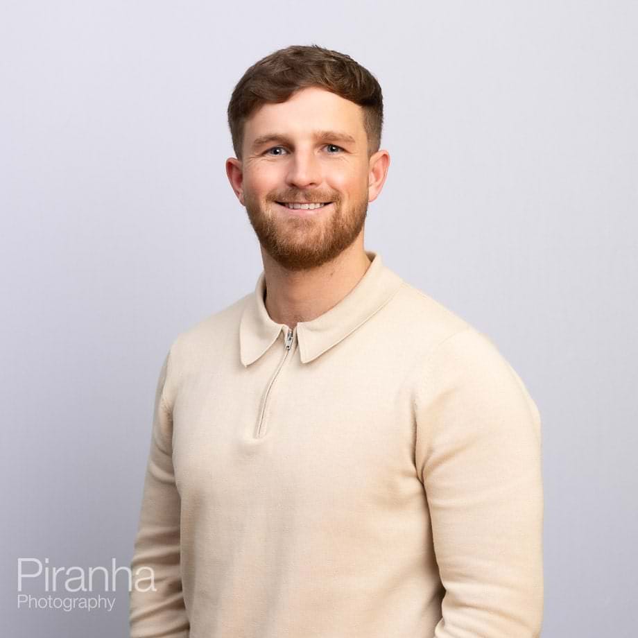 Headshots against white backdrop.