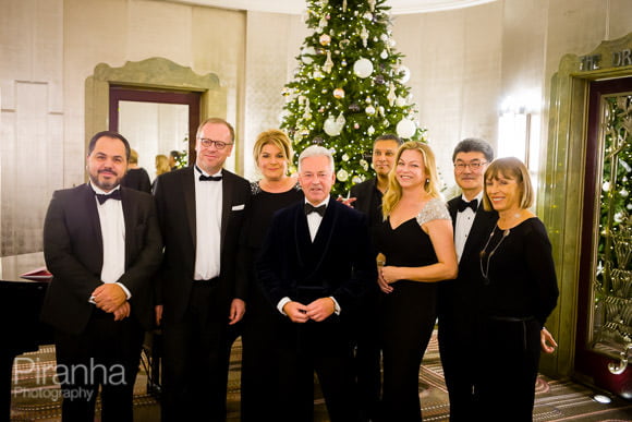 Group photograph with Christmas tree at Hotel in London