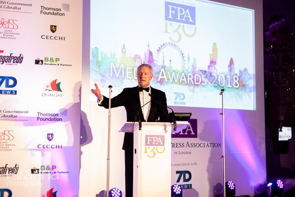 Speaker during awards presentation at london hotel