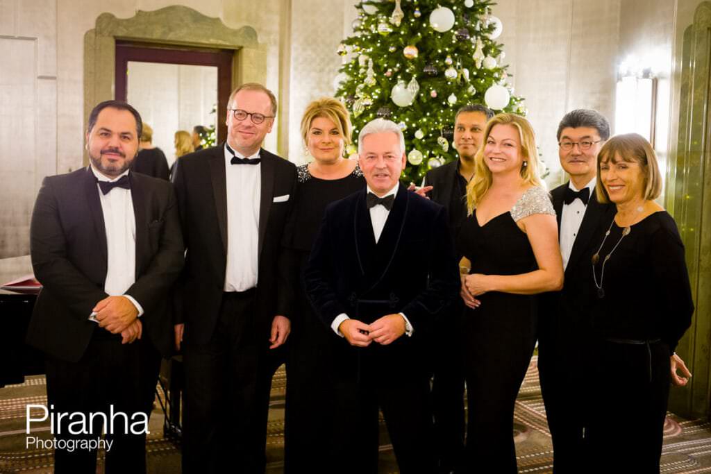 Group photograph with Christmas tree at Hilton Hotel in London