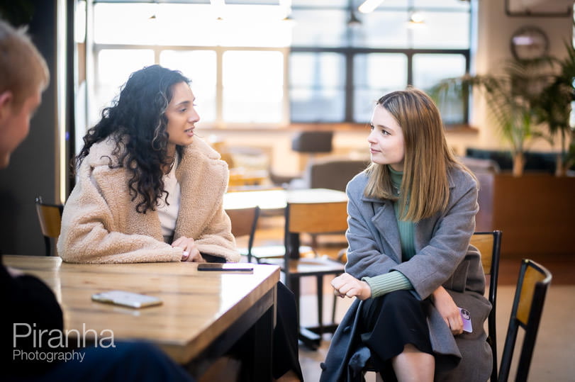 Office photography in London of staff members in conversation