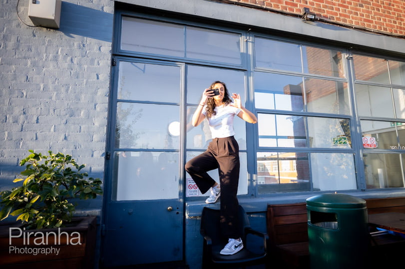 Business photograph of member of staff jumping