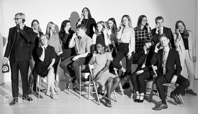 Studio photograph of team in black and white - fun, playful image